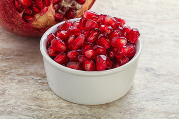 Ripe red Pomegranate seeds in the bowl