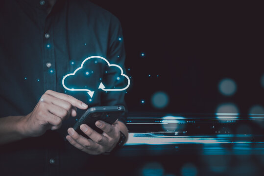 Businessman holding smartphone technology digital with cloud computing icon.Business Cloud computing concept .