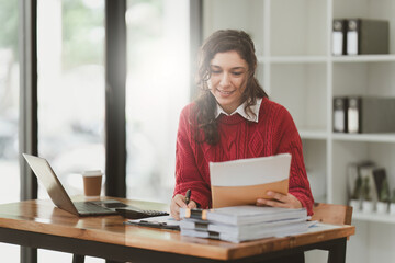 American business woman making prepare presentation or important email of financial. Business...