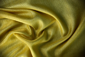 Smooth wavy golden silk and cotton background design and can use as wedding element design, background and wallpaper.