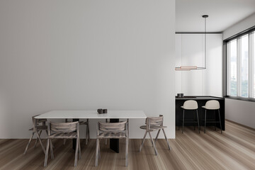 Light kitchen interior with dining area and bar island, window. Mockup wall