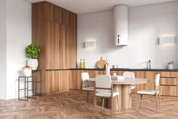 Corner view on bright kitchen room interior with white wall