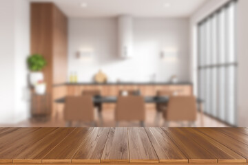 Wooden table in blurred kitchen interior with window. Mockup product display