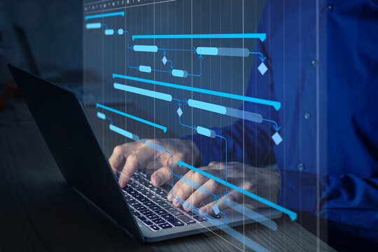 Project manager working with Gantt chart schedule to plan tasks and deliverables. Scheduling activities with planning software. Project management diagram on computer screen.