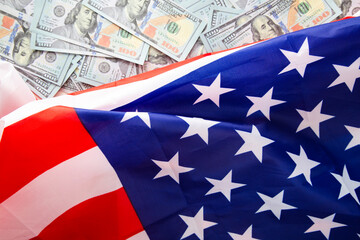 Business and finance concept. USA national flag and currency usd money banknotes.