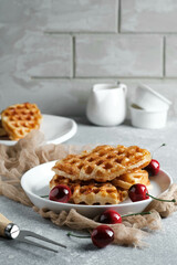 Croffle (a compound word of croissant and waffle) is a dessert where croissant raw paper is baked in a waffle pan and eaten with ice cream or maple syrup