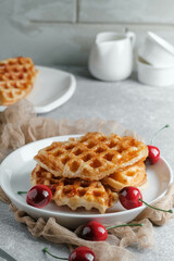 Croffle (a compound word of croissant and waffle) is a dessert where croissant raw paper is baked in a waffle pan and eaten with ice cream or maple syrup