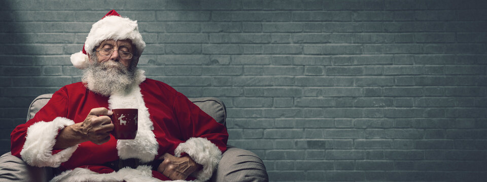 Santa Claus having an hot drink