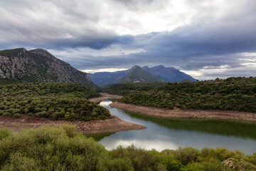 Naklejka na ściany i meble River and Mountain Landscape Nature Background. Sardinia, Italy.
