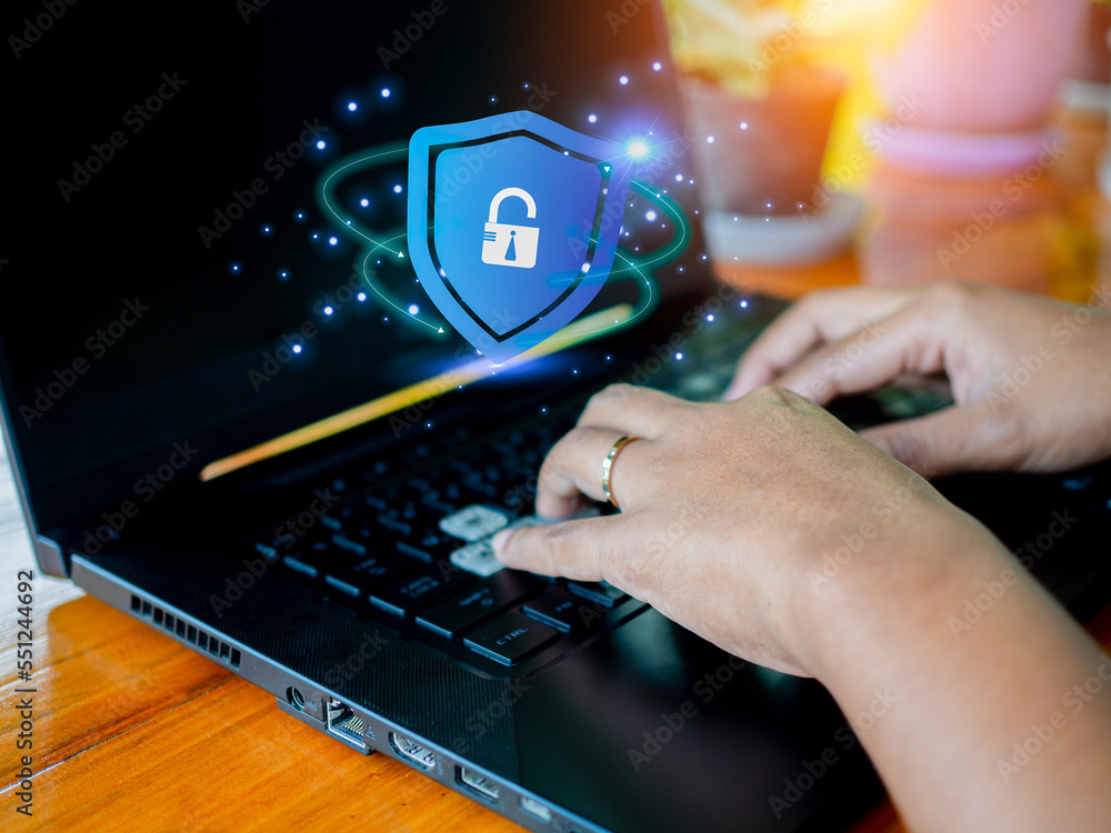 Poster human hand working on computer and protection icon. represents the code protection. security concept