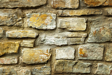 Solid gray and beige stone wall, good for background
