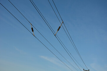 A spacer used to separate high voltage wires, held by a common corridor in the penetration of an...