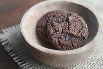 chocolate chip cookies in a wooden bowl