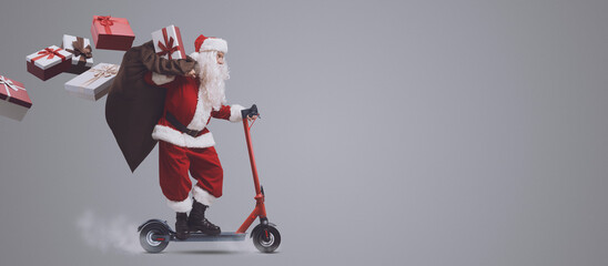Fast Santa Claus on electric scooter