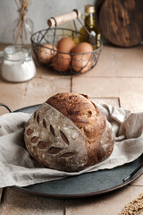 A sourdough bread on table tiles with rustic conceptual