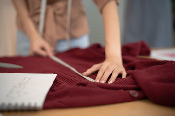 Start-up Stylish Fashion Designer work as sketch of new collection in atelier. Creative Design Concept.