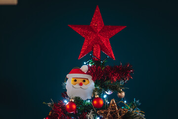 Christmas tree decorated with a top red star