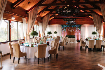 Fototapeta na wymiar Served table in beautiful wooden restaurant. Wedding concept