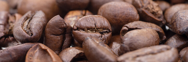 Panoramic background. Closeup of the dry coffee beans