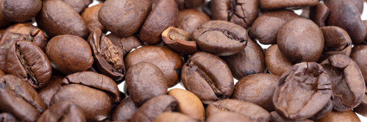 Panoramic background. Closeup of the dry coffee beans