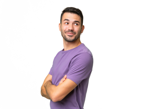 Young handsome caucasian man over isolated background with arms crossed and happy