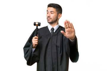 Judge caucasian man over isolated background making stop gesture and disappointed