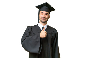 Young university graduate man over isolated background giving a thumbs up gesture