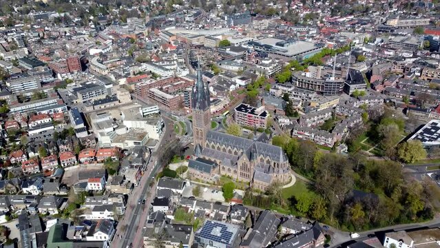 Aerial bird view of famous church in Hilversum the Netherlands the Saint Vitus or Sint Vituskerk has been completed in 1890 and has a 322 feet tall bell tower and is located in the city center 4k