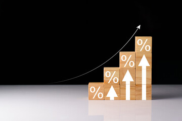 Interest rate and dividend concept, wooden block with percentage symbol and up arrow, Interest...
