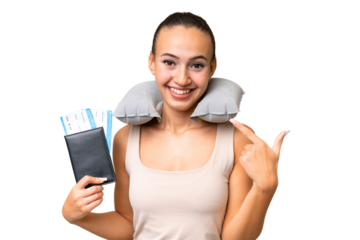 Young Arab woman with Inflatable Travel Pillow over isolated background giving a thumbs up gesture
