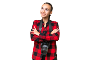 Young photographer Arab woman over isolated background looking up while smiling