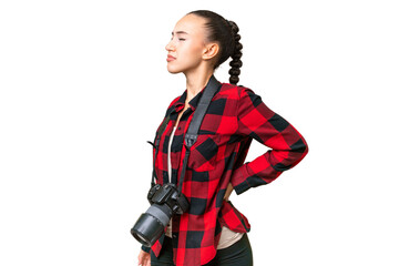Young photographer Arab woman over isolated background suffering from backache for having made an effort