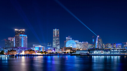 Fototapeta na wymiar Yokohama Minato-Mirai area nightscape with laser show.