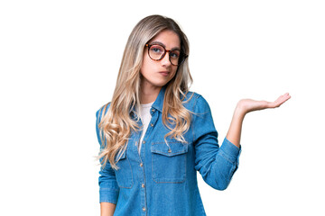 Young Uruguayan woman over isolated background having doubts