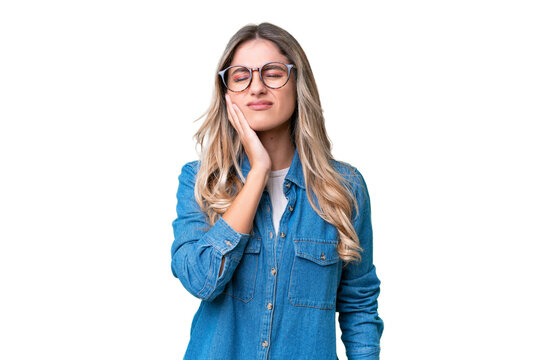 Young Uruguayan woman over isolated background with toothache
