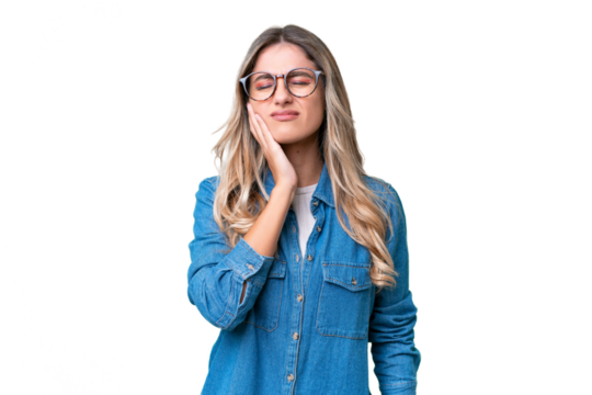 Young Uruguayan woman over isolated background with toothache