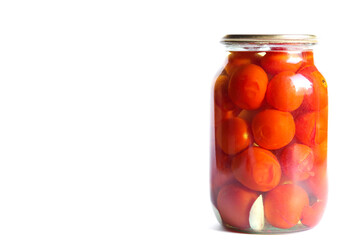 Pickled tomatoes in glass jar isolated on a white background. Space for text.