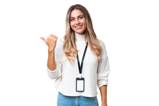 Young Uruguayan woman with ID card over isolated background pointing to the side to present a product
