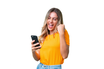 Young Uruguayan woman over isolated background with phone in victory position