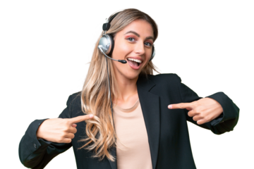 Telemarketer pretty Uruguayan woman working with a headset over isolated background proud and self-satisfied
