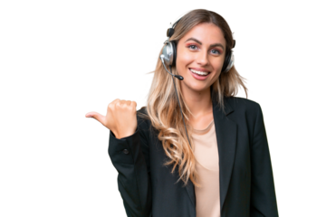 Telemarketer pretty Uruguayan woman working with a headset over isolated background pointing to the side to present a product