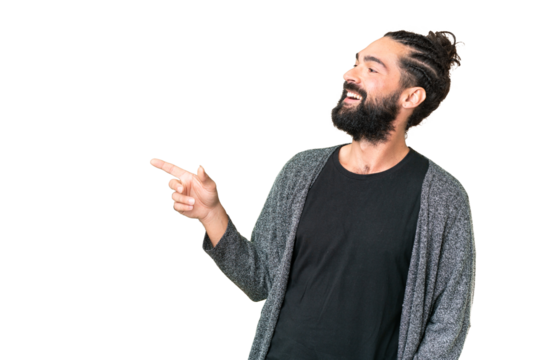 Young man with beard over isolated chroma key background pointing finger to the side and presenting a product