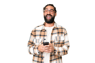 Young man with beard over isolated chroma key background surprised and sending a message