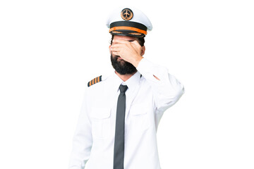 Airplane caucasian pilot man over isolated chroma key background covering eyes by hands. Do not want to see something
