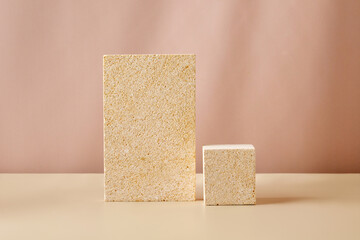Natural Stone Podiums for promotion on beige Background. Beauty product mockup. Scene, blank for show products. Showcase, display case, pedestals with window shadow.