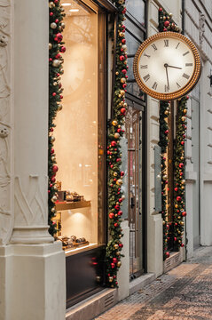 Clock shop with Christmas decor and illumination in Prague.