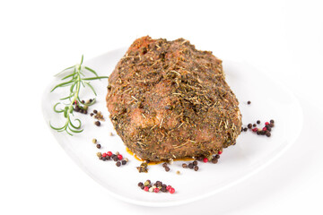 Raw pork loin seasoned - ready to be roasted, on a plate	
