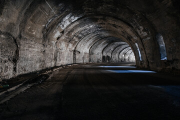 Old underground road tunnel inside mountain