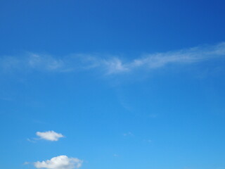 Bright blue sky in summer. Slightly cloudy sky. Quiet atmosphere in summer, International day for the conservation of the ozone layer concept
