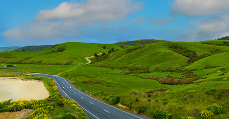 Aerial view  of the Coastal Road, sandy beach and  open sea in summer season Nature recovered Environment and Travel background